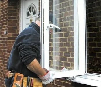 contractor installing windows